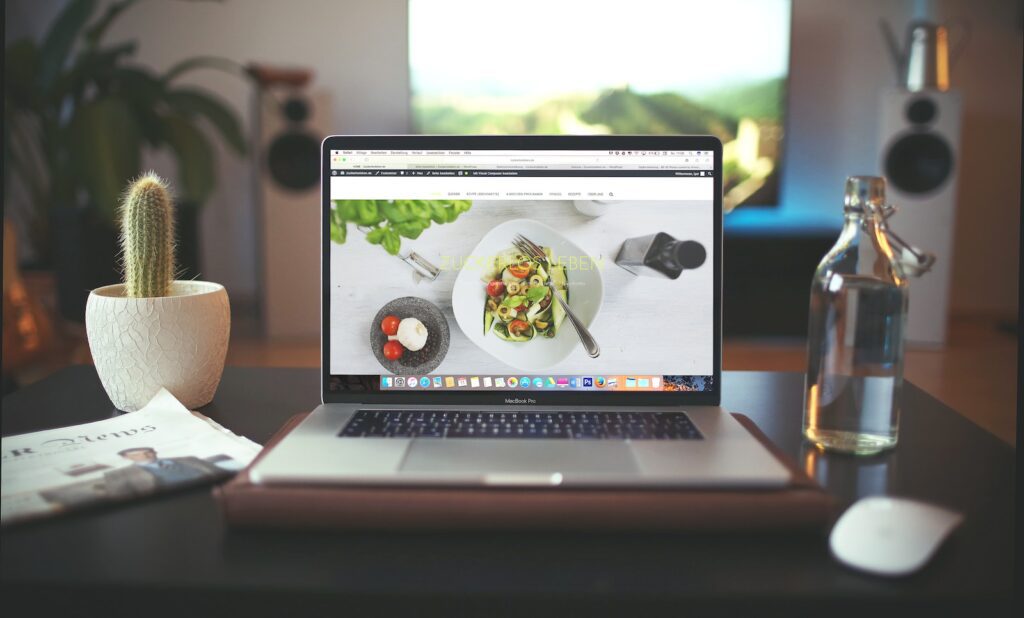 MacBook Pro showing vegetable dish as website design